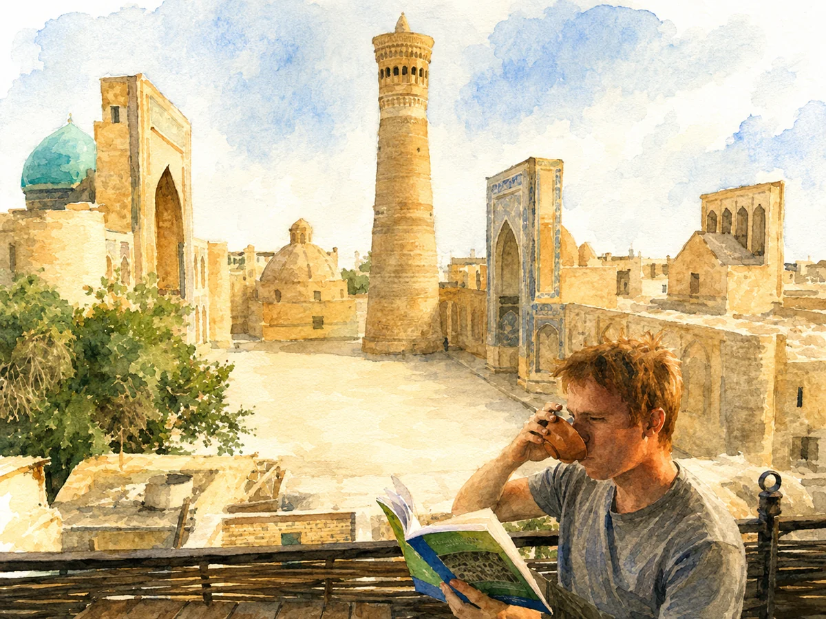 James Pickett reading over tea on a rooftop above the Poi Kalyan
            ensemble in Bukhara